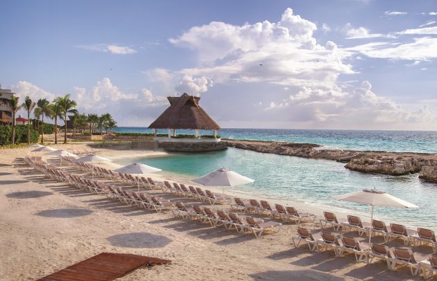 tropical beach with beach chairs