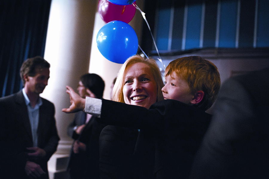 Senator Gillibrand on election night with her son, Henry (Photo by Nancy Borowick)