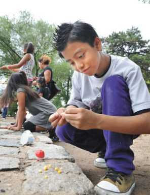 Young anglers learn how to cast and fly fish