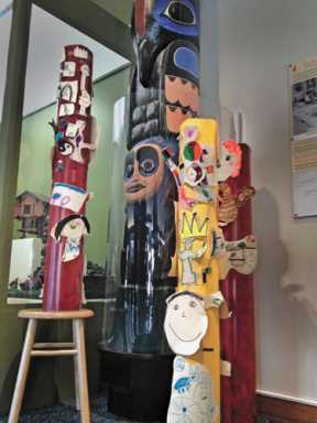 Join a group and make a totem pole.