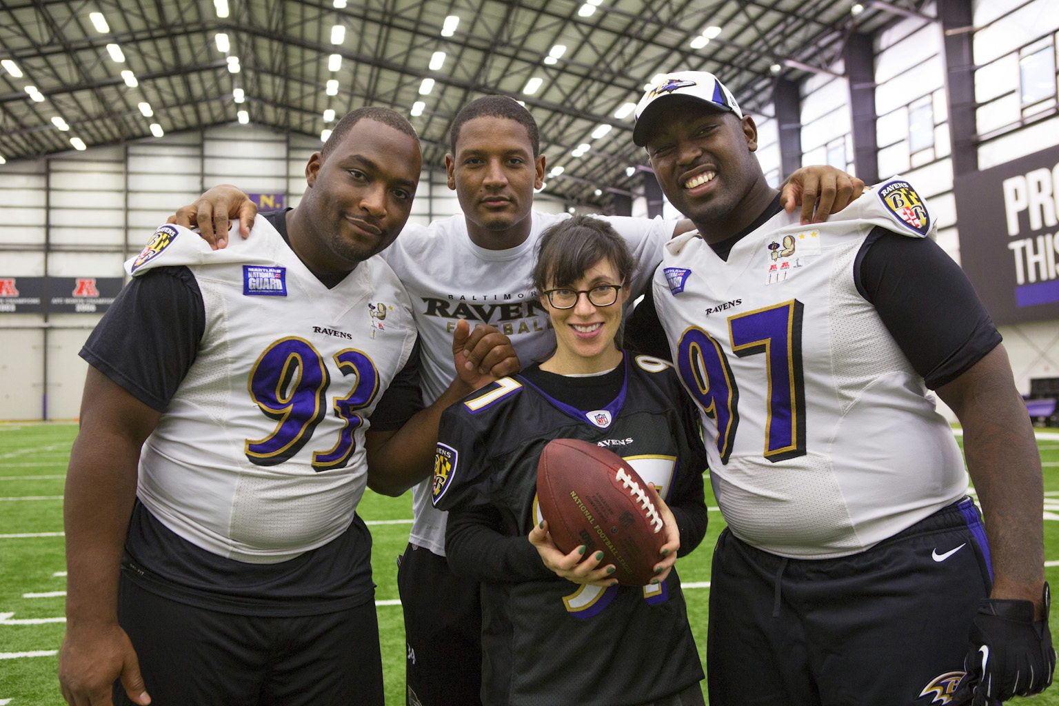 Andrea Rosen, with Arthur Jones, Ed Dickson, and DeAngelo Tyson of the Baltimore Ravens.
