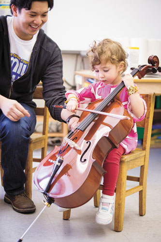 Children in the Anderson School are treated to a fun day of music and games