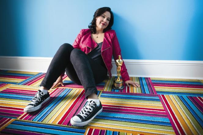 Kristen Anderson-Lopez hangs out at home in Brooklyn with her Oscar. Photo by Ali Smith Photography