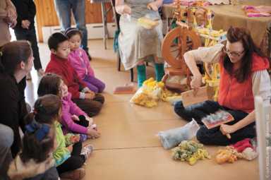 Children explore the farm and learn about sheep shearing.