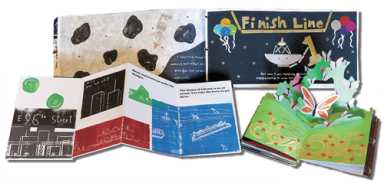 An open pop-up book shows 3D paper butterflies and greenery alongside several other colorful handmade storybooks.