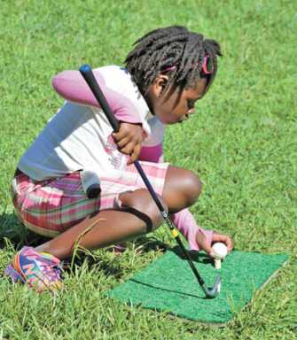 Fore! Children learn to tee-off