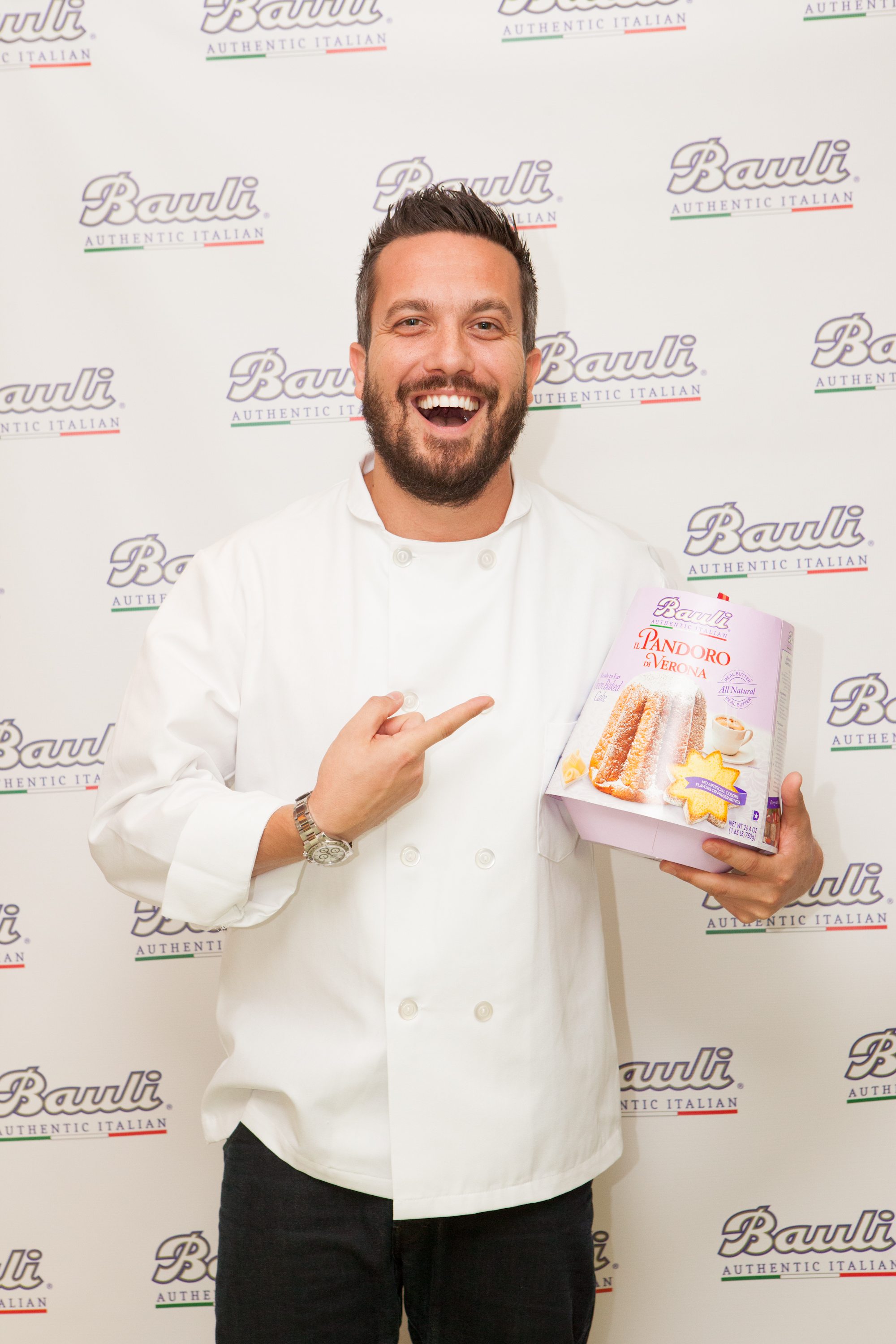 Fabio strikes a pose with one of the Bauli holiday cakes.