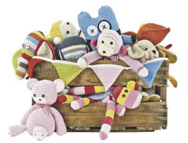 A wooden crate filled with various colorful crocheted stuffed animals, including a monkey, elephant, and pink bear.