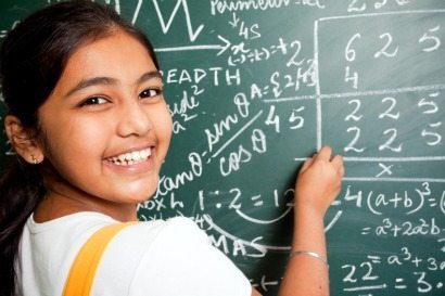 Cheerful Indian Girl Student with Mathematics Problems