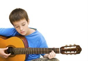 kid-playing-guitar