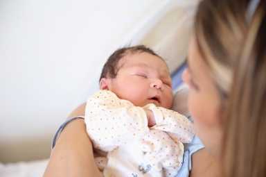 New born baby with his mother