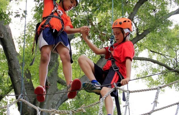 kids doing a ropes course at camp