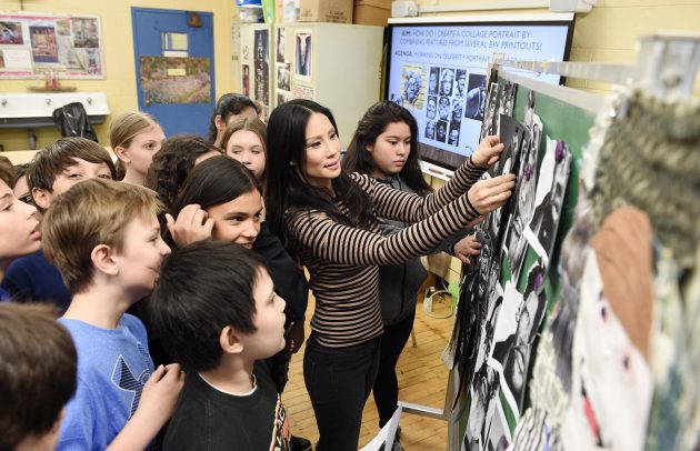 Lucy liu at a school with kids