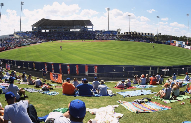 people at baseball field watching 