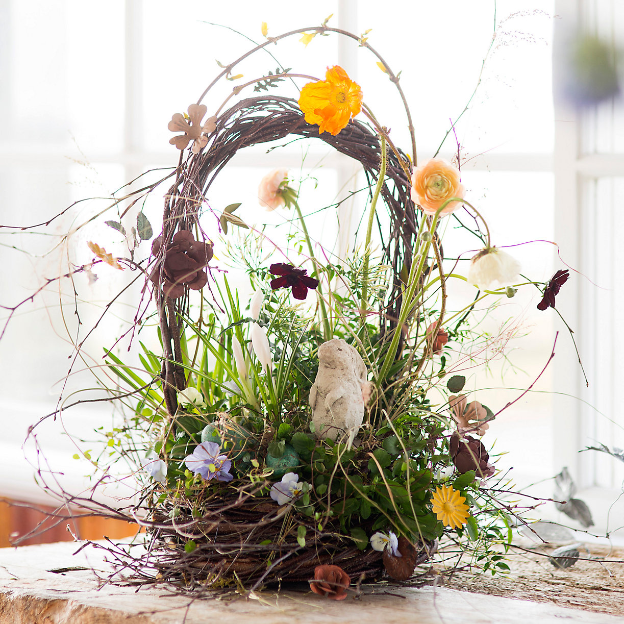 Easter basket made of rustic twigs and flowers from Terrain
