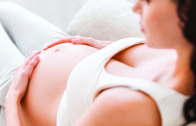 pregnant woman dressed in white