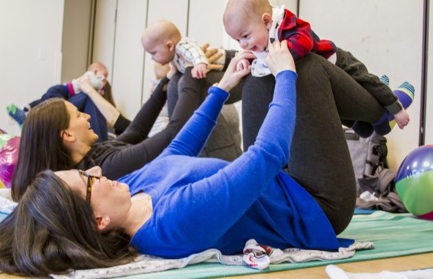 mother and baby doing yoga