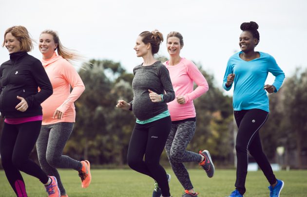 group of pregnant women jogging outside