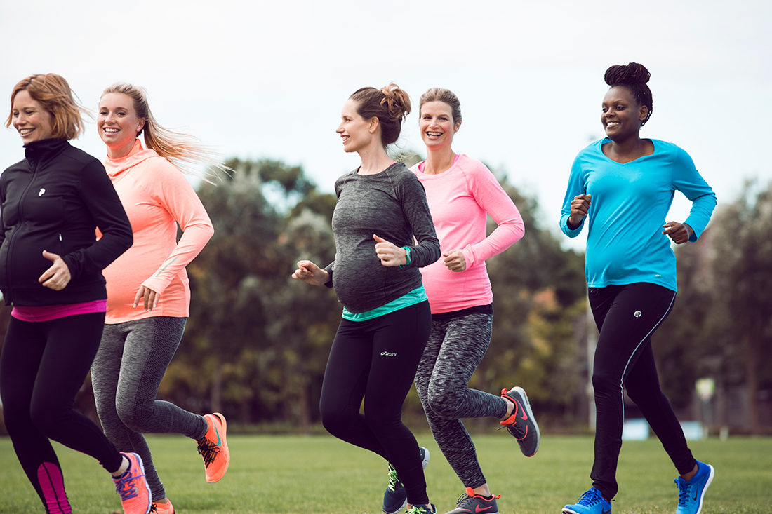 group of pregnant women jogging outside