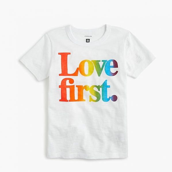 white tee shirt with rainbow lettering