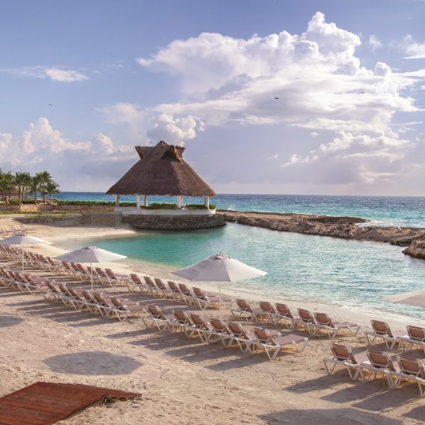 tropical beach with beach chairs