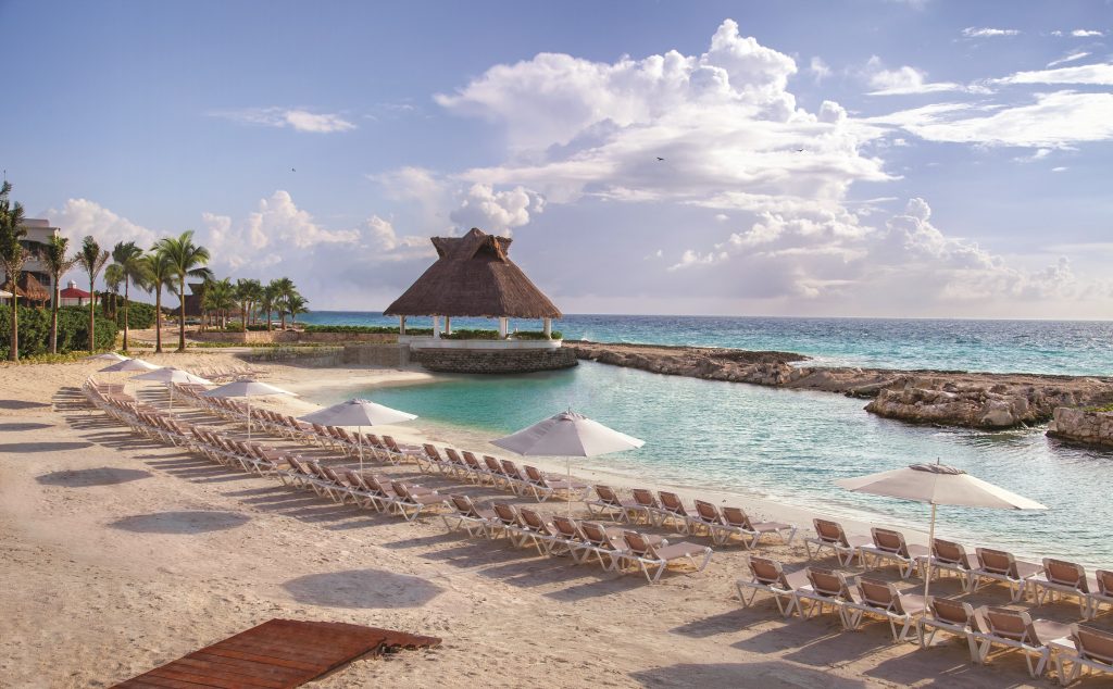 tropical beach with beach chairs