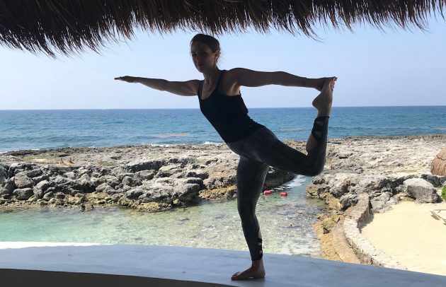 rock om yoag on the beach in mexico