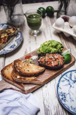 avocado toast on rustic board