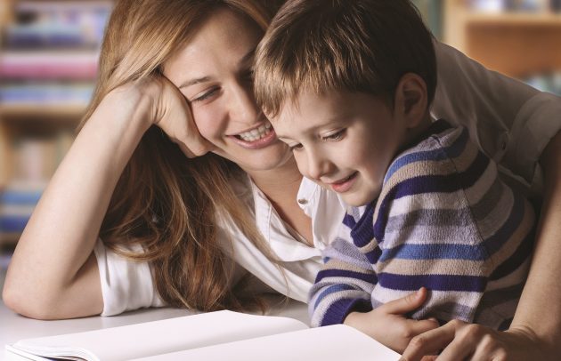 mother and child reading a book together for back-to-school