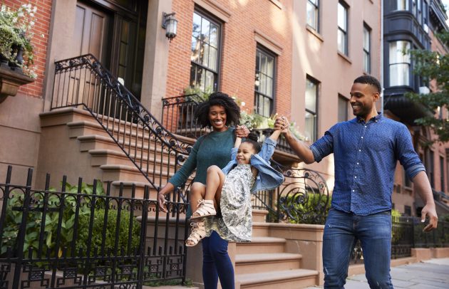Family taking a walk down the street, close up