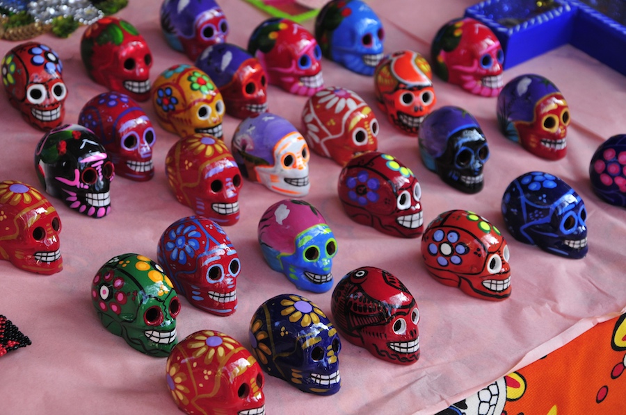 multi colored dead of the dead skulls on a table