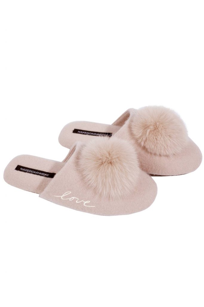 light pink slipper with furry pom poms on top