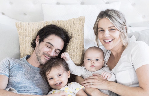 Ali Fedotowsky with family in bed
