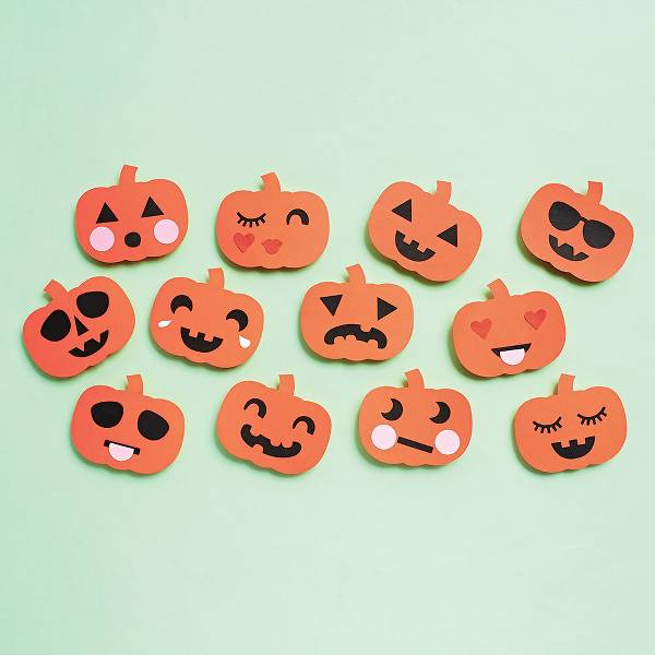 paper craft pumpkins all with different facial expressions