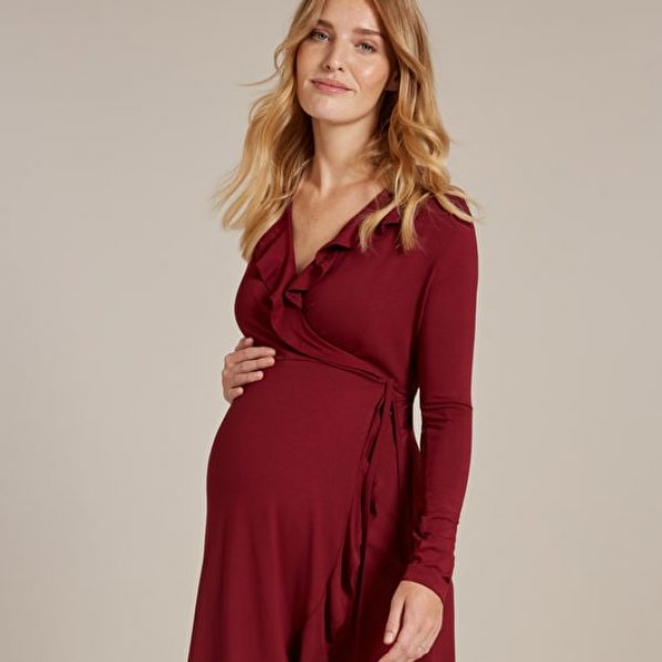 pregnant model in red wrap dress with ruffles