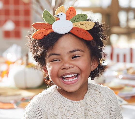 little girl wearing a thanksgiving headband