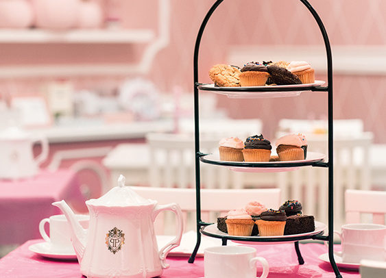 cute pink tea set with little cakes