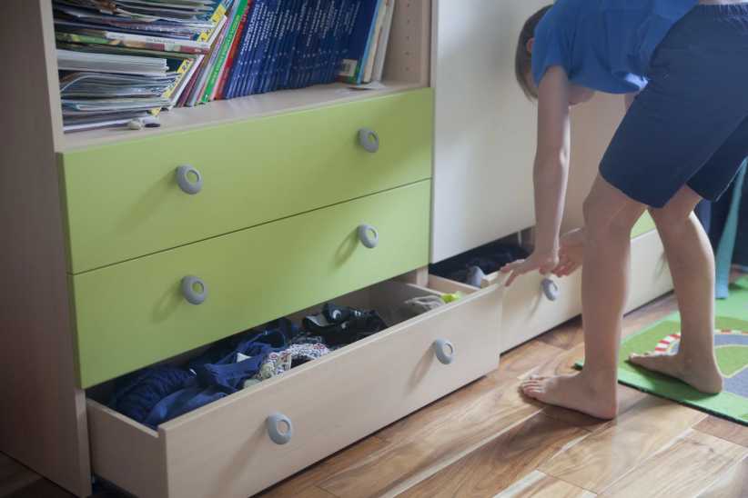 Open drawer full of clothes in a kids bedroom, Create a Calm, Sleep-Friendly Bedroom for Your Child: 4 Simple Changes