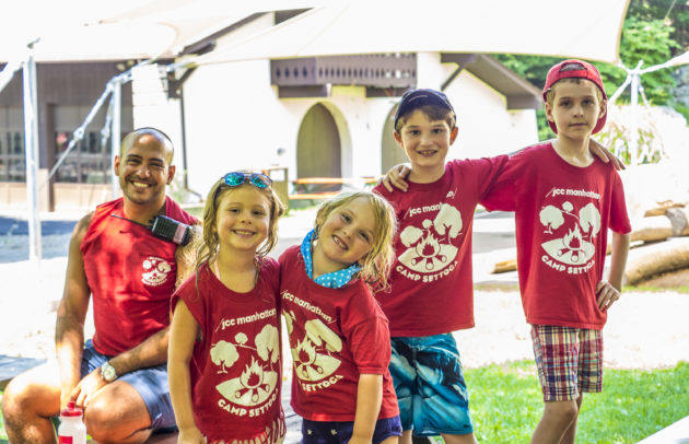 group of kids at camp wearing red shirts