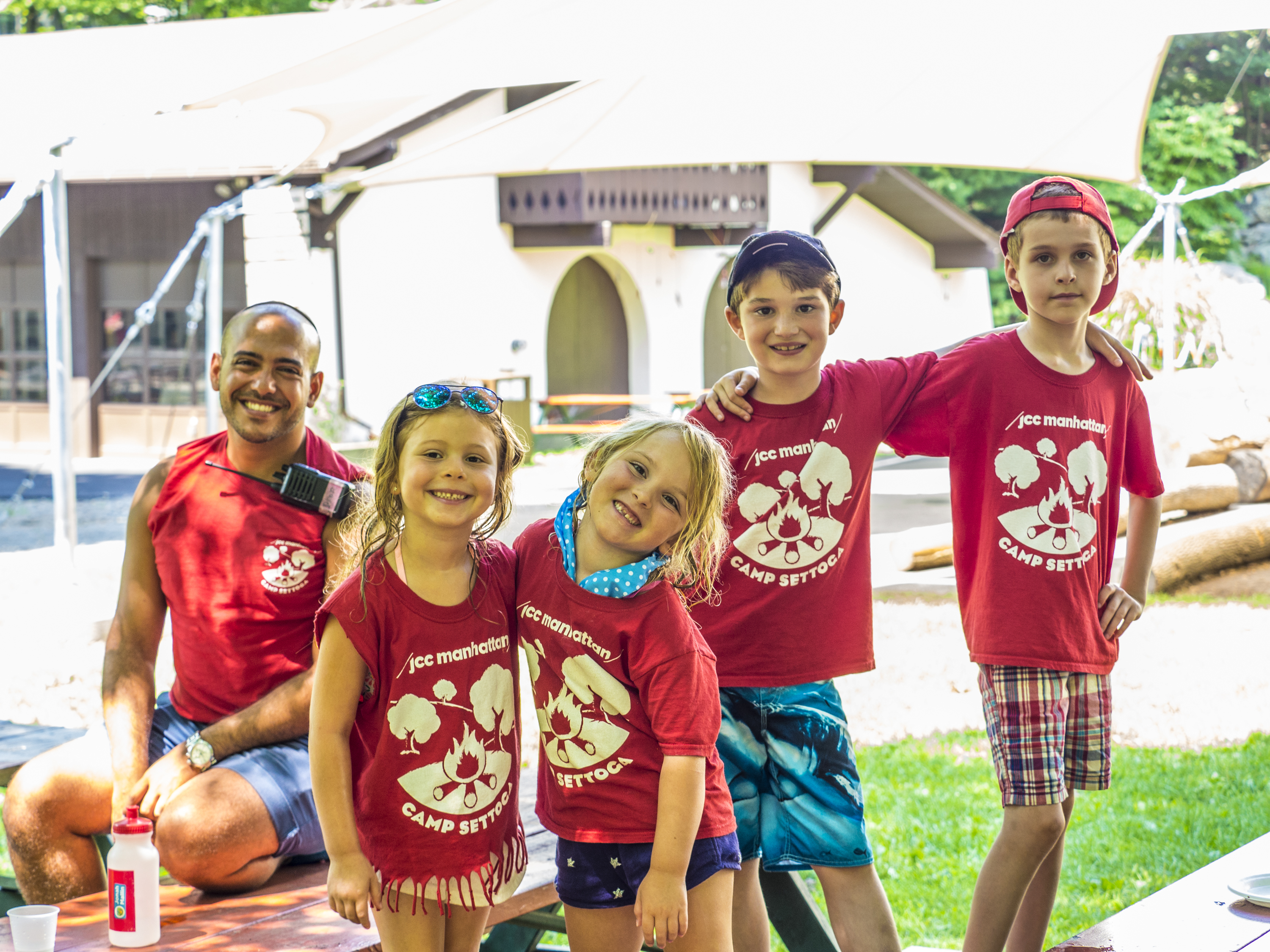 group of kids at camp wearing red shirts