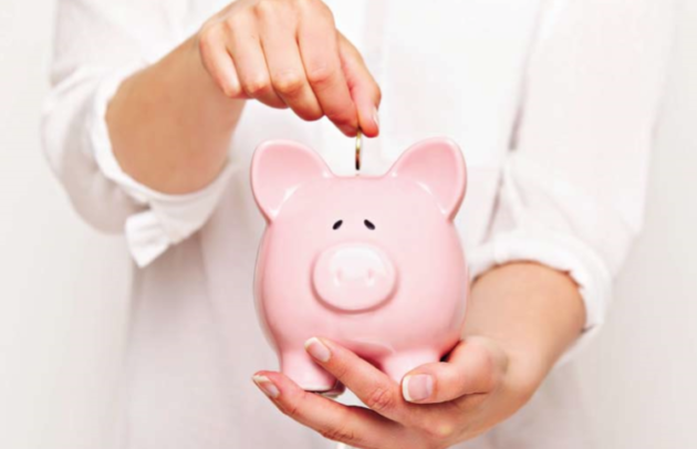 woman holding piggy bank