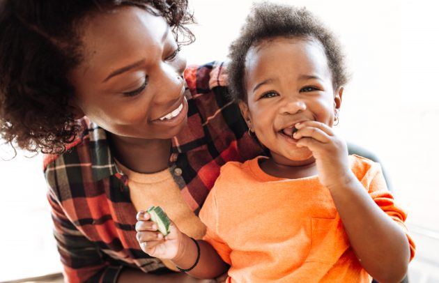 african american mother with her smiling toddler