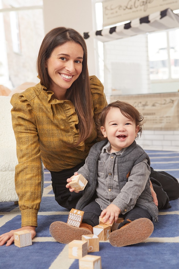 stylish mom posing with her young toddler son