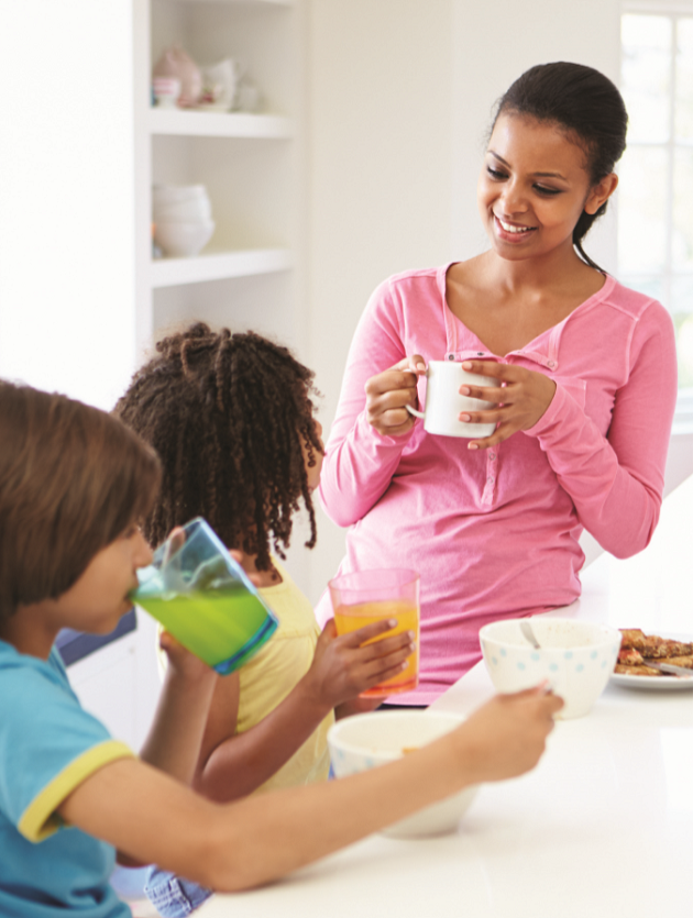 mom having breakfast with her two young children