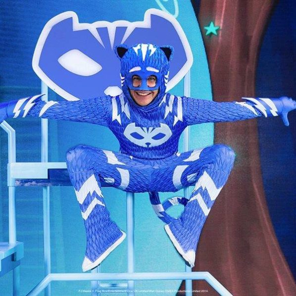actor dressed as a blue cat in a children's musical