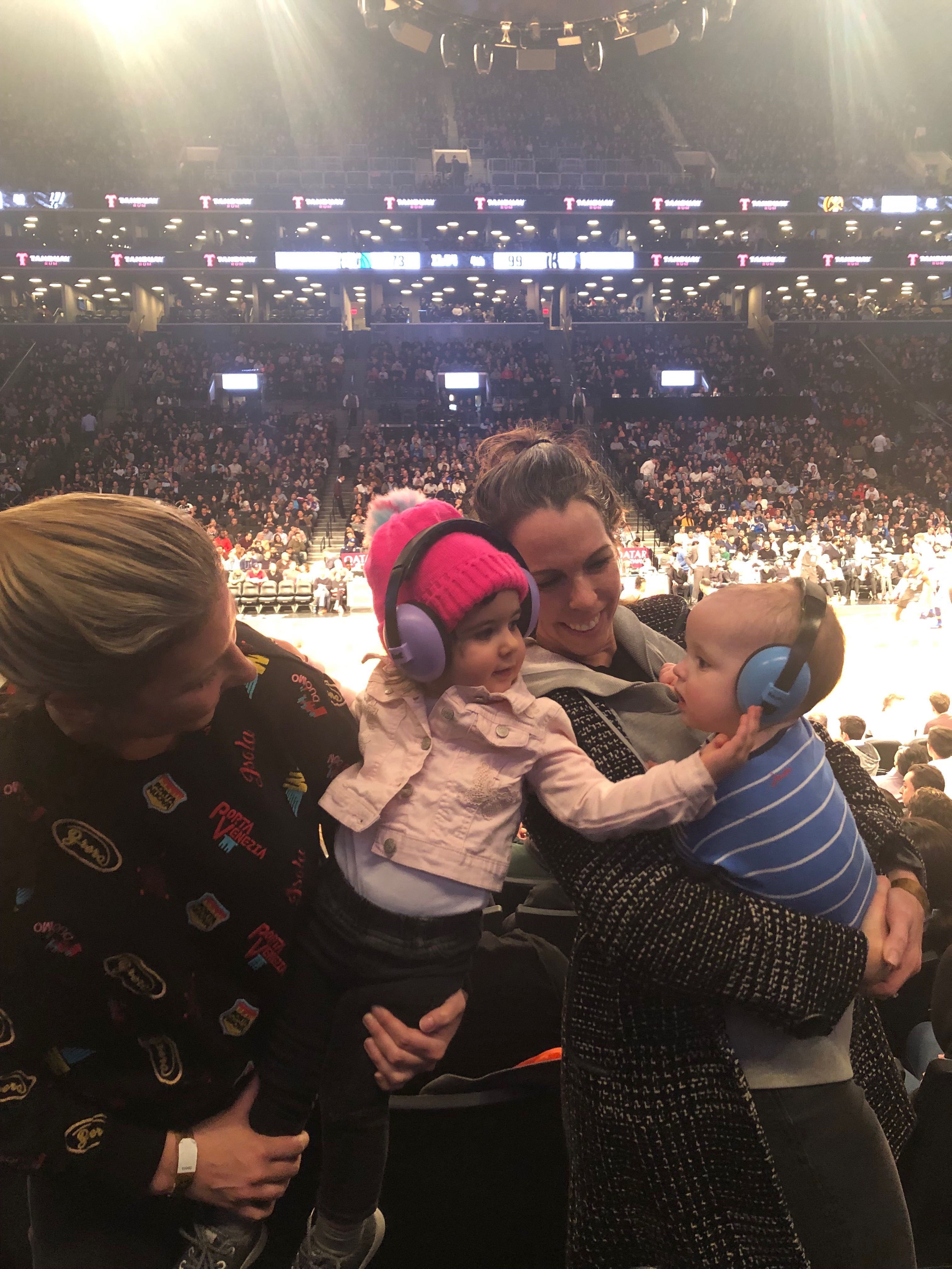 Picture of moms and kids at an NBA game