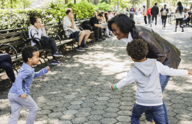 Dawn Smalls playing with her kids in the park