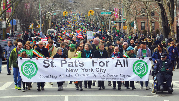 St. Pat's For All Banner held up at the front of the parade procession