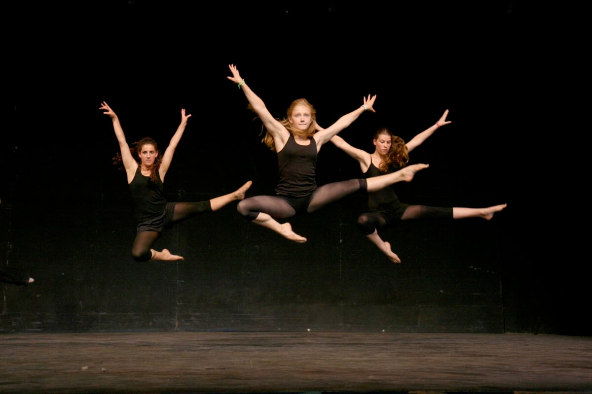 girls-jumping-in-the-air-on-stage.jpg
