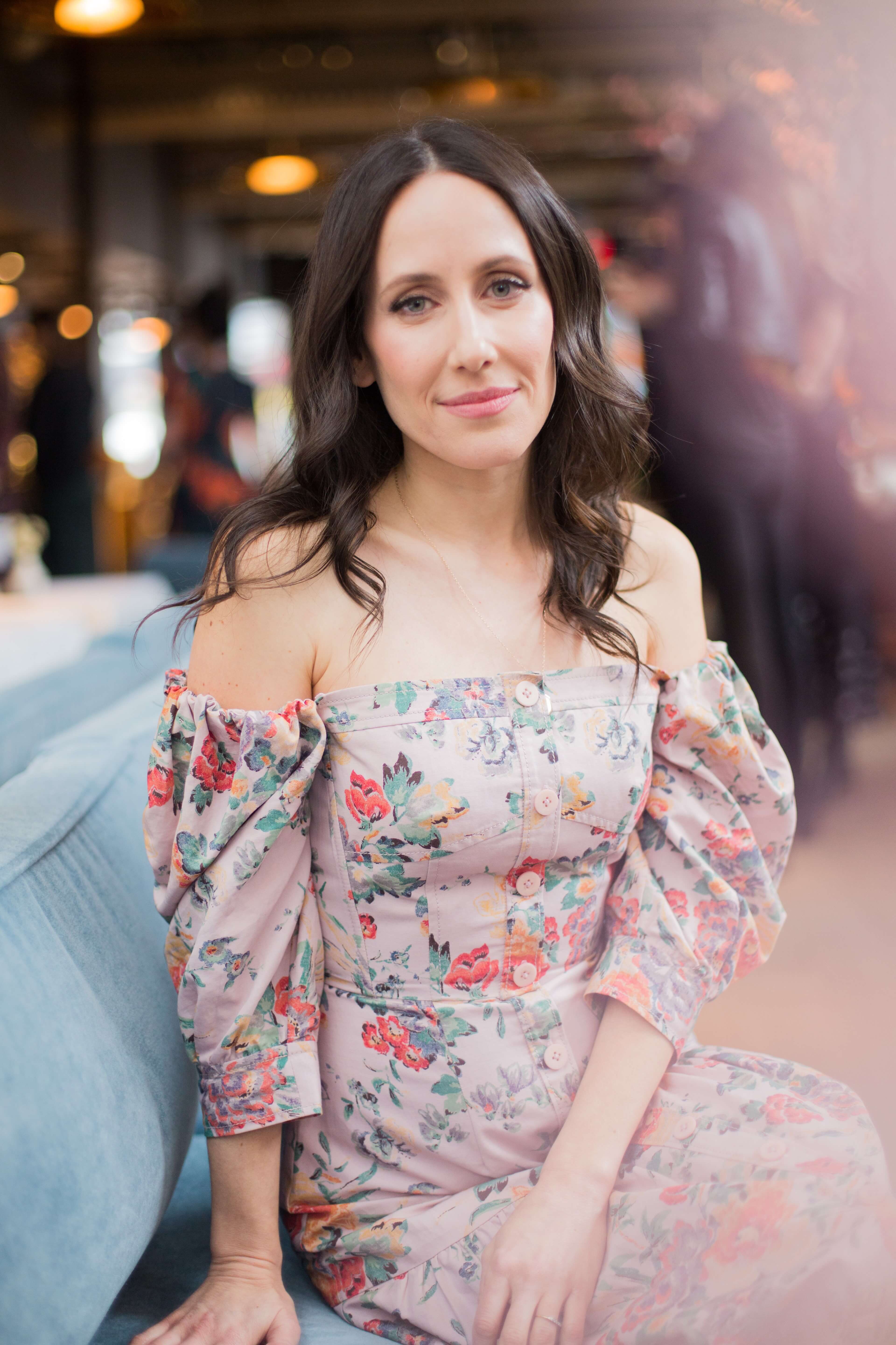 portrait of a brunette women in a pink dress